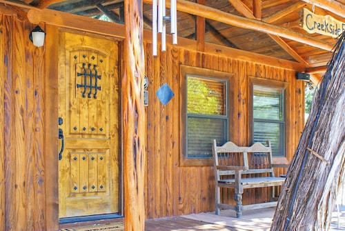 Charming Creekside Cabin w/ Hot Tub, Fire Pit & Natural Rock Waterfalls