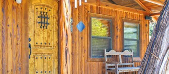 Charming Creekside Cabin w/ Hot Tub, Fire Pit & Natural Rock Waterfalls
