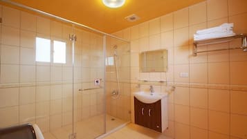 Economy Quadruple Room, 2 Queen Beds, Non Smoking | Bathroom | Shower, free toiletries, hair dryer, slippers