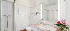 Shower, hair dryer, bathrobes, towels