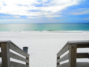 A wooden boardwalk leading to a beach with white sand and a view of the ocean. - Huge Beachfront*no steps*large corner patio *Two King Beds*75” tv!*Beach towels (Fort Walton Beach)