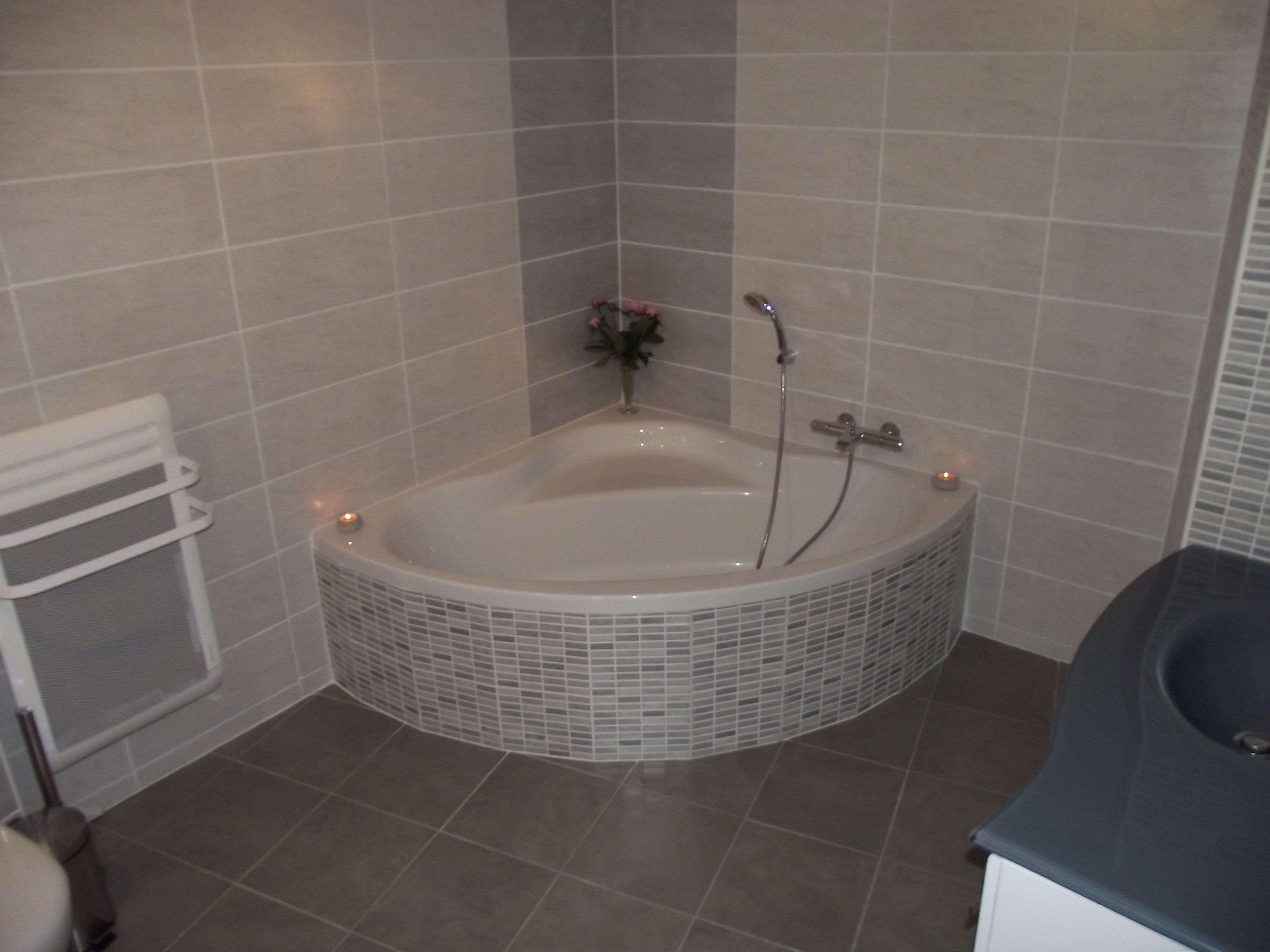 A bathroom with a freestanding bathtub, a shower, and a toilet.