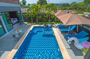 Outdoor pool, open 9:00 AM to 10:30 PM, pool umbrellas, pool loungers
