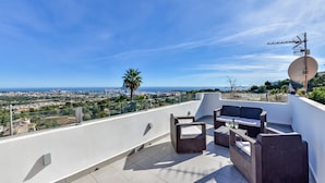 A rooftop terrace with outdoor furniture, a satellite dish, and a city view. - Bellavista - Villa with panoramic sea views and large terraces (Calpe / Calp)