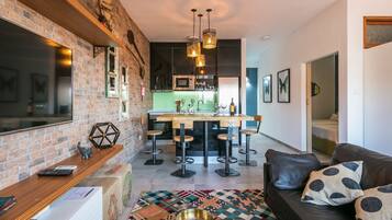 Family Apartment, 1 Bedroom, City View | Living room | 42-inch flat-screen TV with cable channels, TV