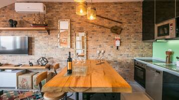 Family Apartment, 1 Bedroom, City View | In-room dining