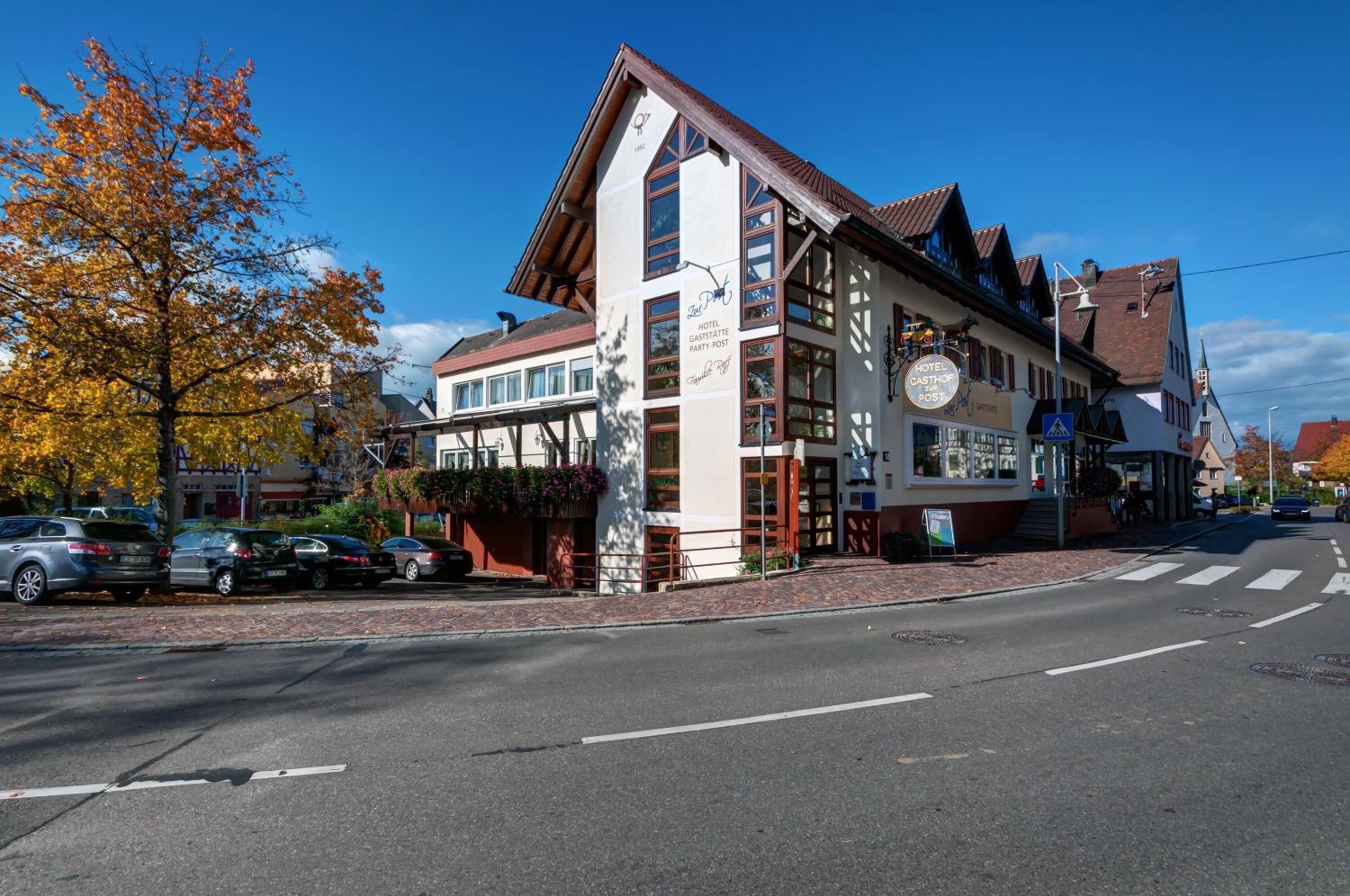 A traditional building with a sign indicating it is a hotel and restaurant.