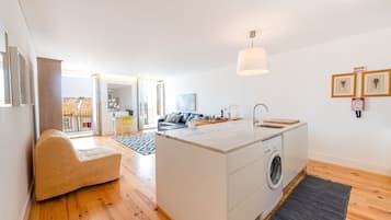 Family Apartment, 1 Bedroom, Balcony, River View | Living area | 32-inch flat-screen TV with cable channels, TV