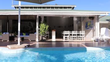 Outdoor pool, open 7:00 AM to 7:00 PM, pool loungers