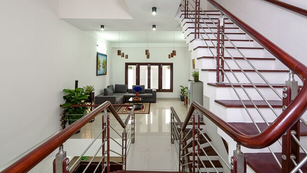 A modern living room with a staircase.