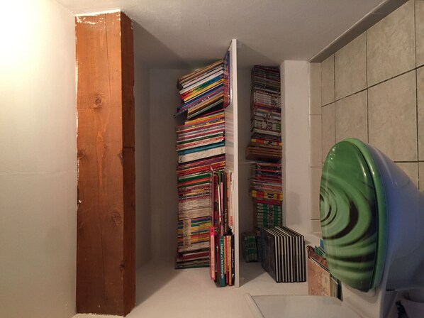 A narrow hallway with a wooden door on the left and a green appliance on the right. - LA VILLA DES SABLES, quiet near the Mediterranean Sea (Agde)