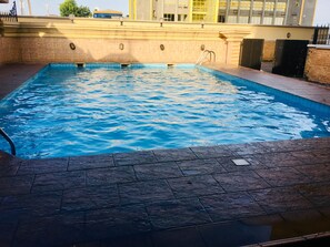 Outdoor pool, pool umbrellas, pool loungers