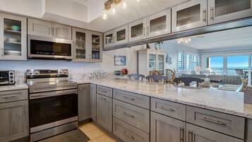 Condo, 2 Bedrooms | Private kitchen | Fridge, oven, coffee/tea maker