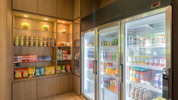A vending machine area with snacks and beverages.