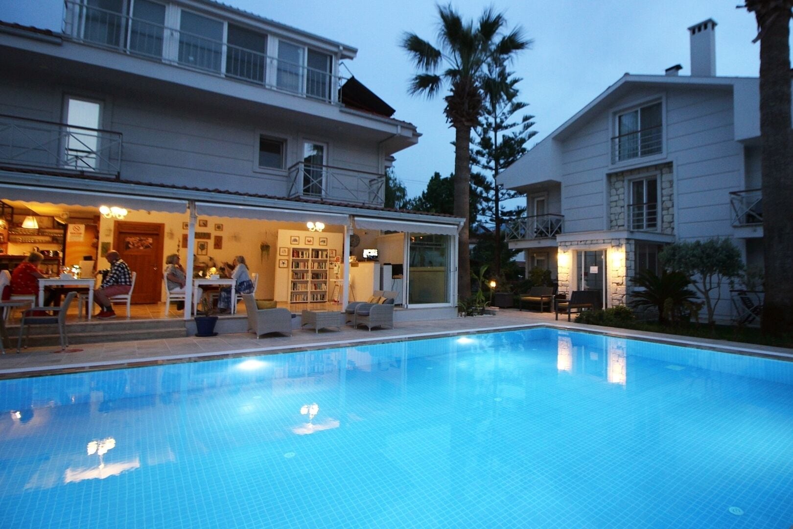 Seasonal outdoor pool, open 9:00 AM to 6:00 PM, pool umbrellas