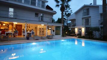 Seasonal outdoor pool, open 9:00 AM to 6:00 PM, pool umbrellas