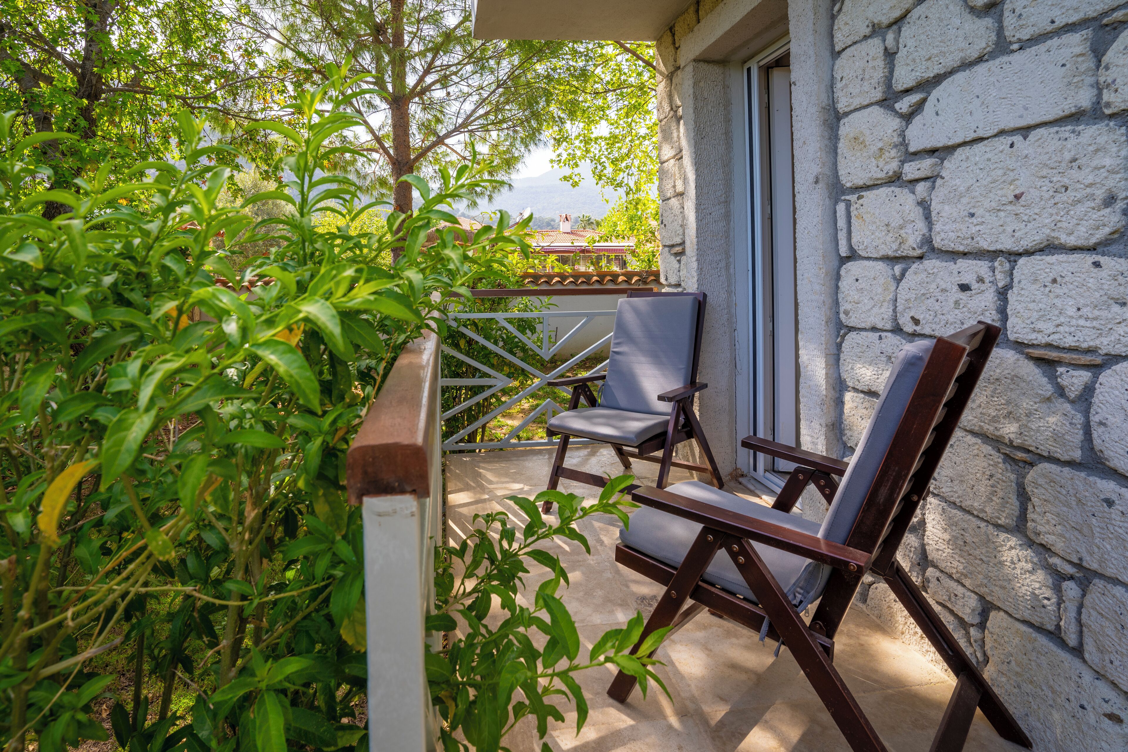 standard triple room, garden view | terrace/patio