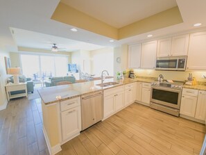 Fridge, microwave, oven, stovetop - Sandpiper's Cove 203  Luxury Coastal Living in Clearwater Beach (Clearwater Beach)