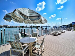 Outdoor dining - Sandpiper's Cove 203  Luxury Coastal Living in Clearwater Beach (Clearwater Beach)