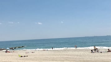 On the beach, sun loungers, beach towels