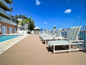 A heated pool, pool loungers