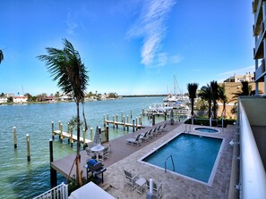 A heated pool, pool loungers - Sandpiper's Cove 201 Sandpiper's Cove Luxury 3 Bedroom 2 Bathroom (Clearwater Beach)