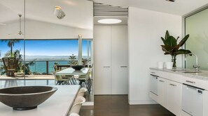 Fridge, stovetop, dishwasher, coffee/tea maker