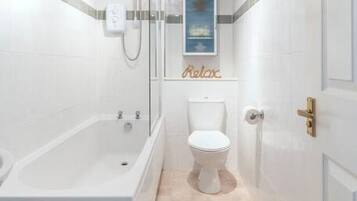Combined shower/bathtub, hair dryer, towels, soap