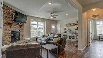 TV, fireplace, books