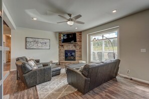 TV, fireplace, books