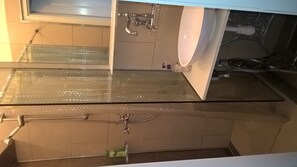 Shower, hair dryer, slippers, towels