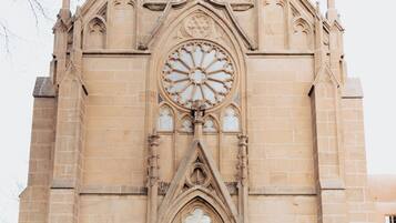 A church with a large rose window and a wooden door.