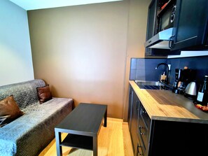 Superior Cabin, Ensuite, Garden View (Balnéo et Hammam) | Shared kitchen | Mini-fridge, microwave, stovetop, coffee/tea maker - Appart Hotel Relax Spa (Lens)