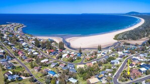 An aerial view of a coastal residential area with houses, roads, and a beach. - Jewel of Gerroa, Gerroa, South Coast (Gerroa)
