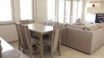 Family Apartment, Ocean View | Living area | Plasma TV