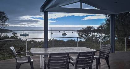 Rest A Shore is a waterfront property with spacious living and north facing panoramic view over the bay from the front deck.