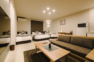Habitación estándar (102) | Zona de estar | Una televisión de pantalla plana