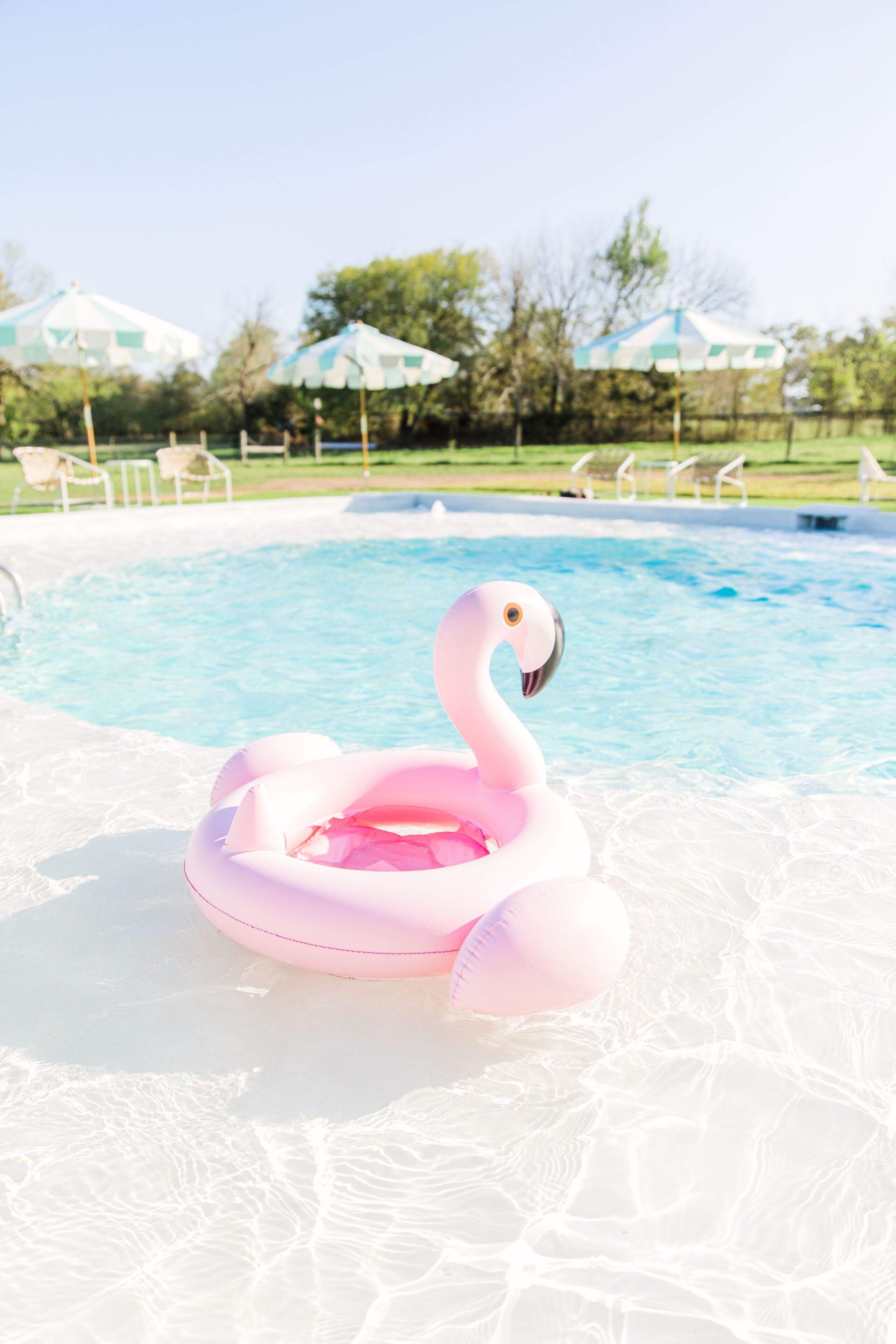 Outdoor pool, open 9:30 AM to 10:00 PM, pool umbrellas, pool loungers