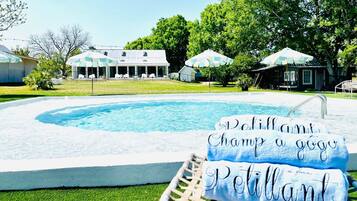 Outdoor pool, open 9:30 AM to 10:00 PM, pool umbrellas, pool loungers