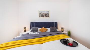 2 dormitorios, tabla de planchar con plancha, cuna de viaje y wifi