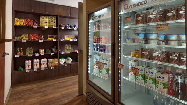 A refrigerated display case with various dairy products and beverages.