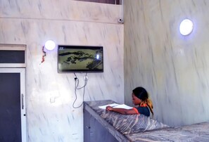 Desk, laptop workspace, bed sheets