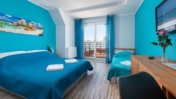 Triple Room | Living area | Flat-screen TV