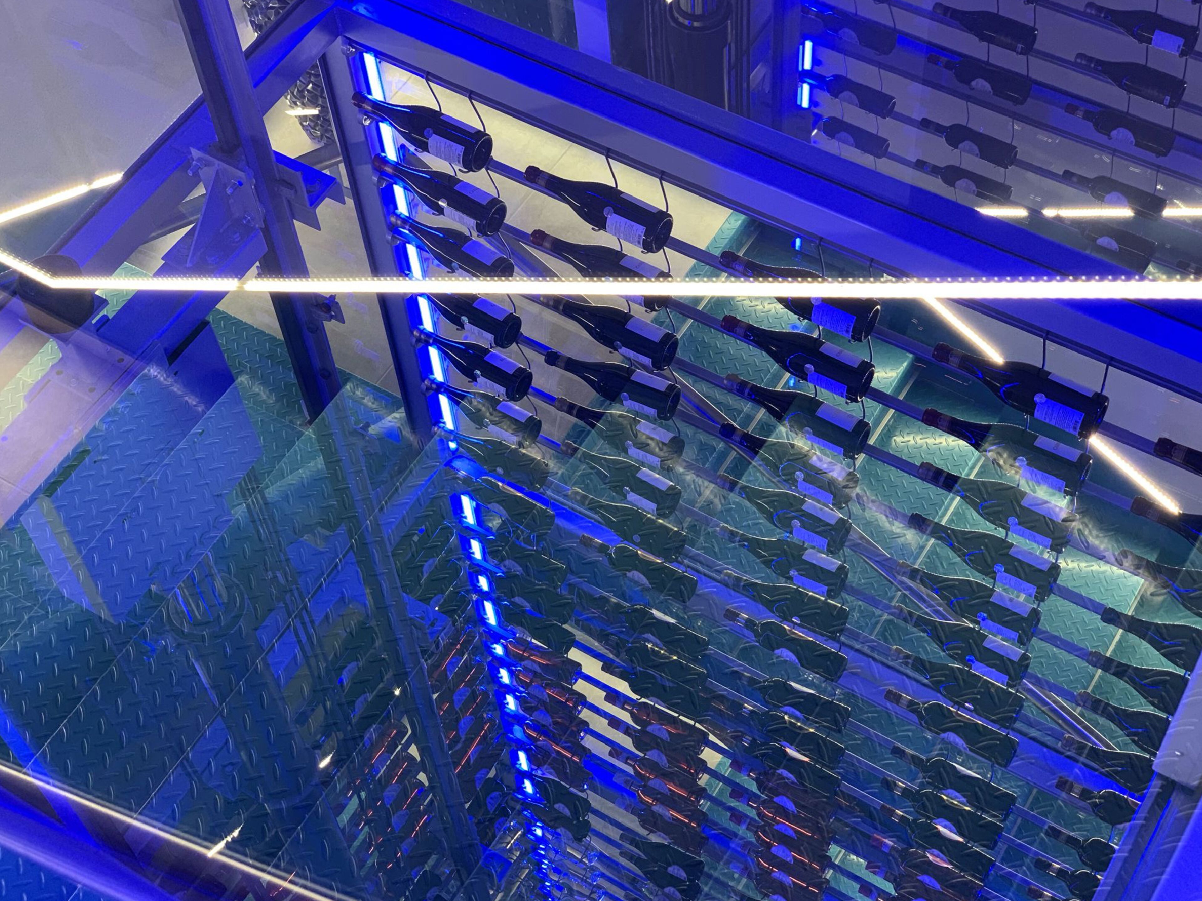 A modern interior with a glass ceiling, allowing natural light to illuminate the space.
