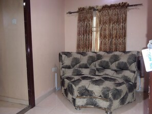 Suite, 1 Queen Bed | Living area | 32-inch plasma TV with satellite channels, TV - Murray's Suites (Ibadan)