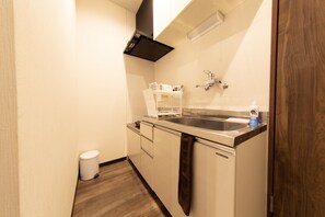 Family Room | Private kitchenette | Fridge, microwave, stovetop, electric kettle - Guest House ICHIKA (Kyoto)