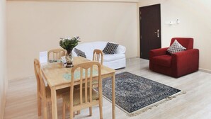 Appartement Deluxe, 1 chambre | Repas dans la chambre
