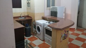 Apartment, 2 Bedrooms | Private kitchen | Fridge, microwave, oven, stovetop - 2 Bedrooms at Heart of Hurghada (Hurghada)