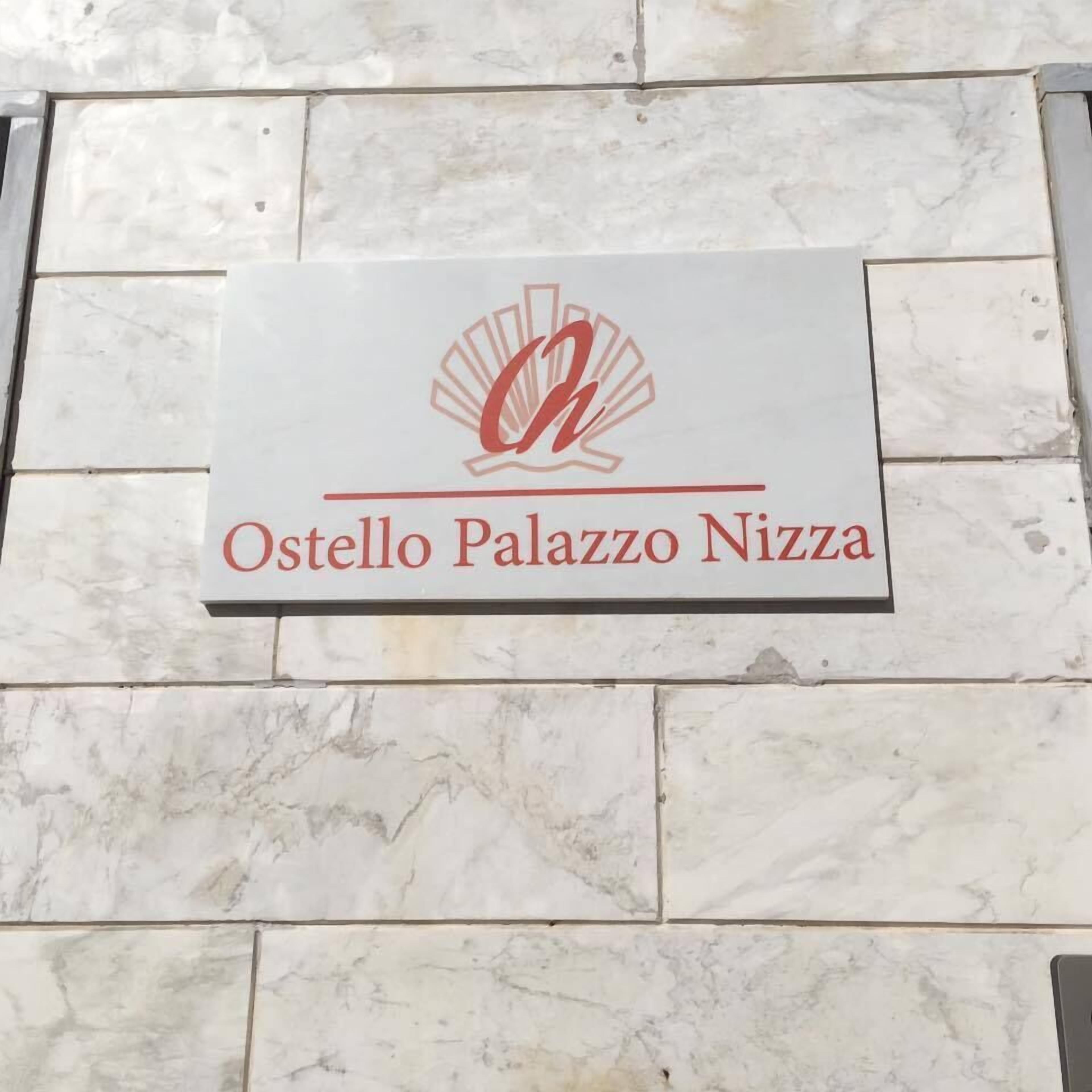 A sign for Ostello Palazzo Nizza.