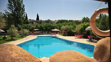 Seasonal outdoor pool, pool umbrellas, sun loungers